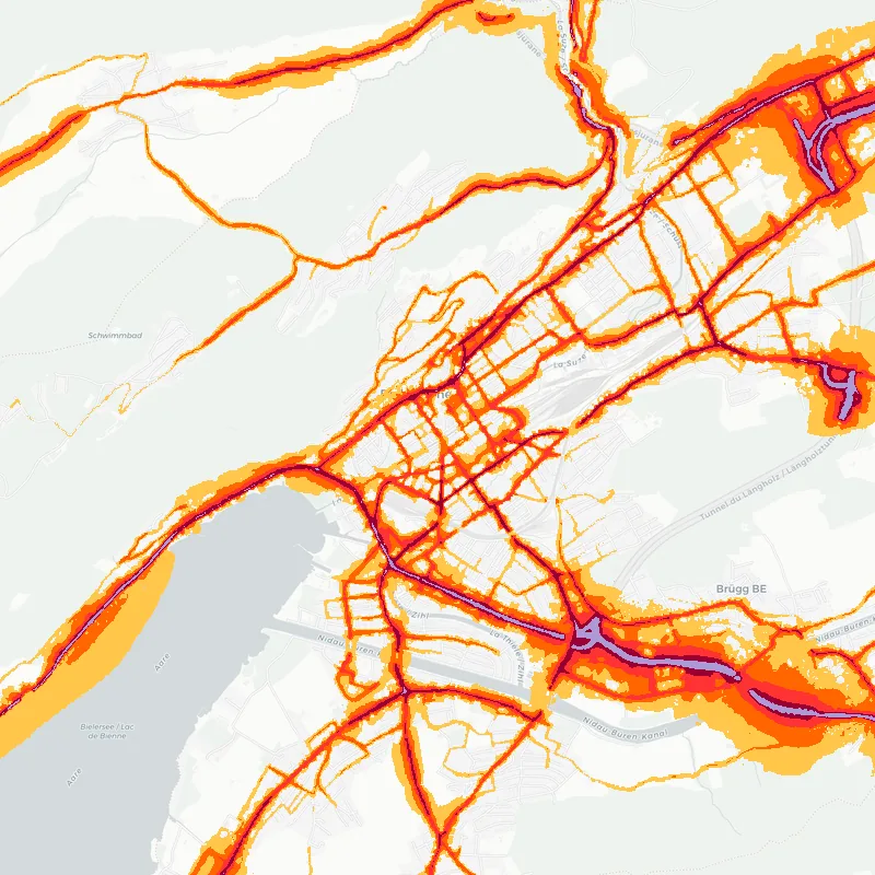 Noise map of Biel/Bienne, Switzerland: road-traffic noise contours from the EU strategic noise maps, shaded yellow (≈55 dB Lden) through orange and red to dark purple (≈75 dB+), over the city's street network.