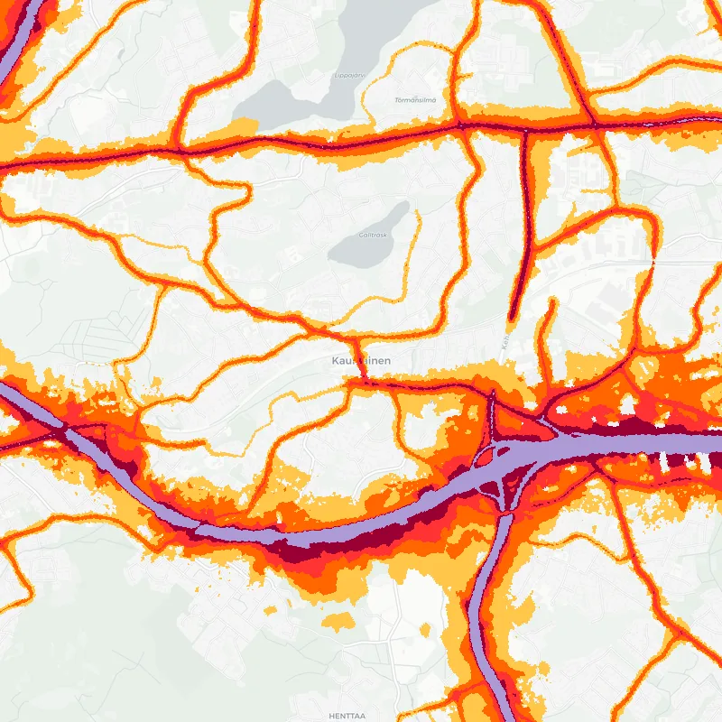 Noise map of Kauniainen, Finland: road-traffic noise contours from the EU strategic noise maps, shaded yellow (≈55 dB Lden) through orange and red to dark purple (≈75 dB+), over the city's street network.