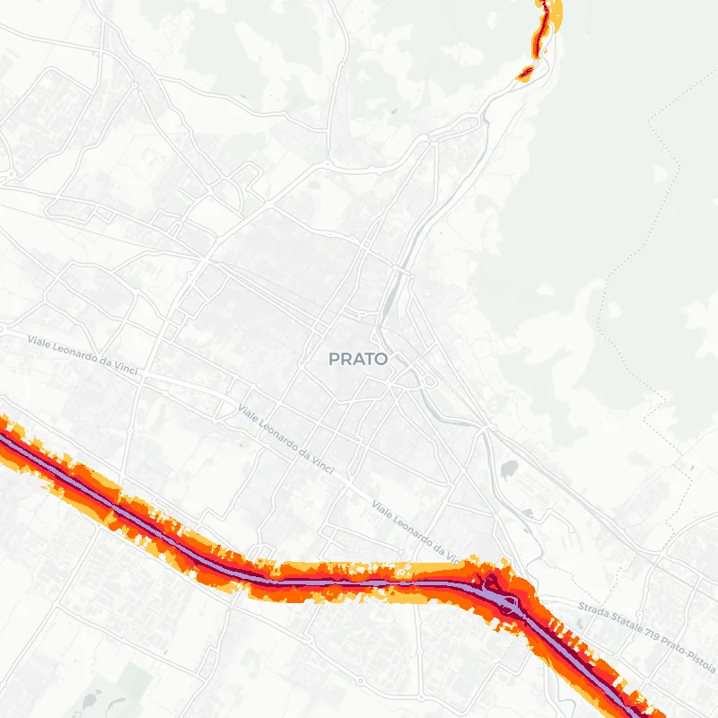 Noise map of Prato, Italy: road-traffic noise contours from the EU strategic noise maps, shaded yellow (≈55 dB Lden) through orange and red to dark purple (≈75 dB+), over the city's street network.