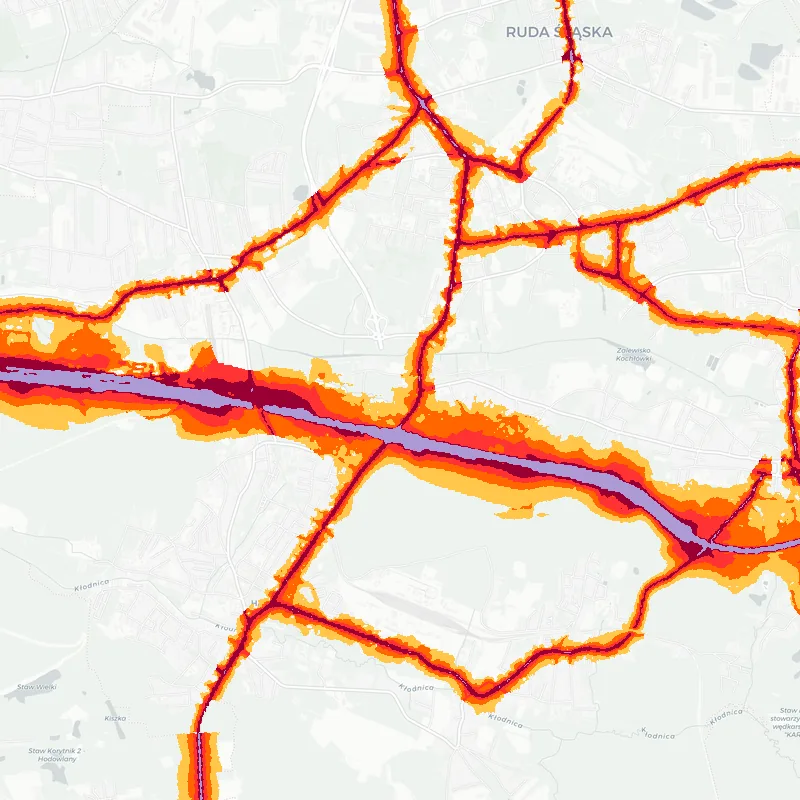 Noise map of Ruda Slaska, Poland: road-traffic noise contours from the EU strategic noise maps, shaded yellow (≈55 dB Lden) through orange and red to dark purple (≈75 dB+), over the city's street network.