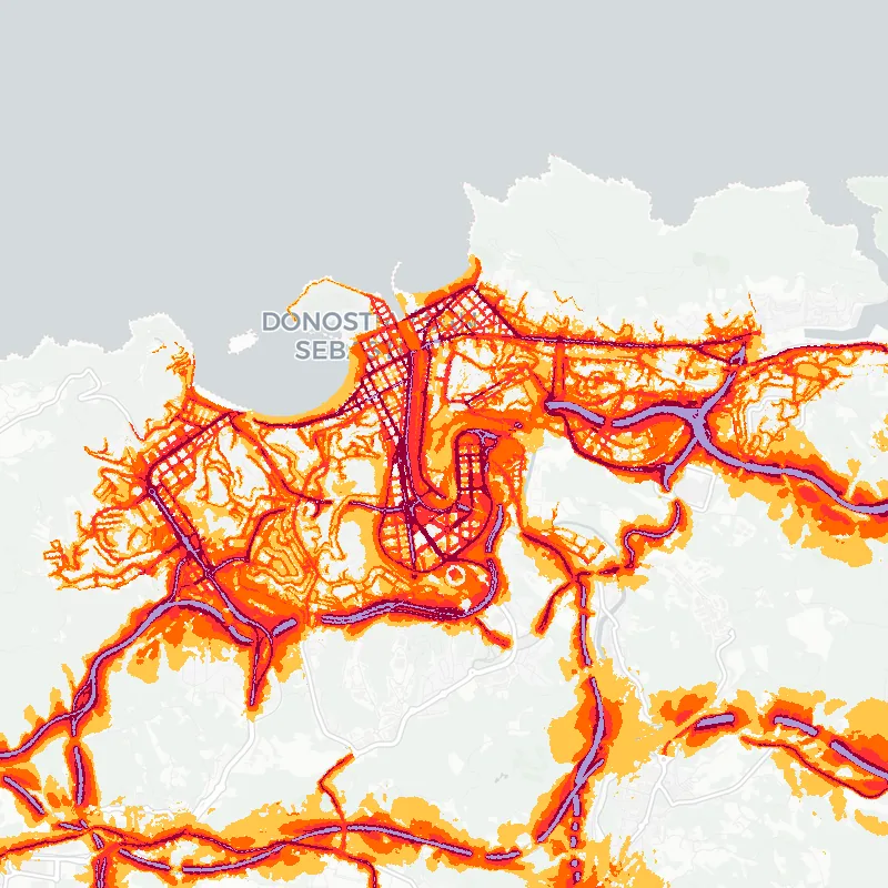 Noise map of San Sebastian - Donostia, Spain: road-traffic noise contours from the EU strategic noise maps, shaded yellow (≈55 dB Lden) through orange and red to dark purple (≈75 dB+), over the city's street network.