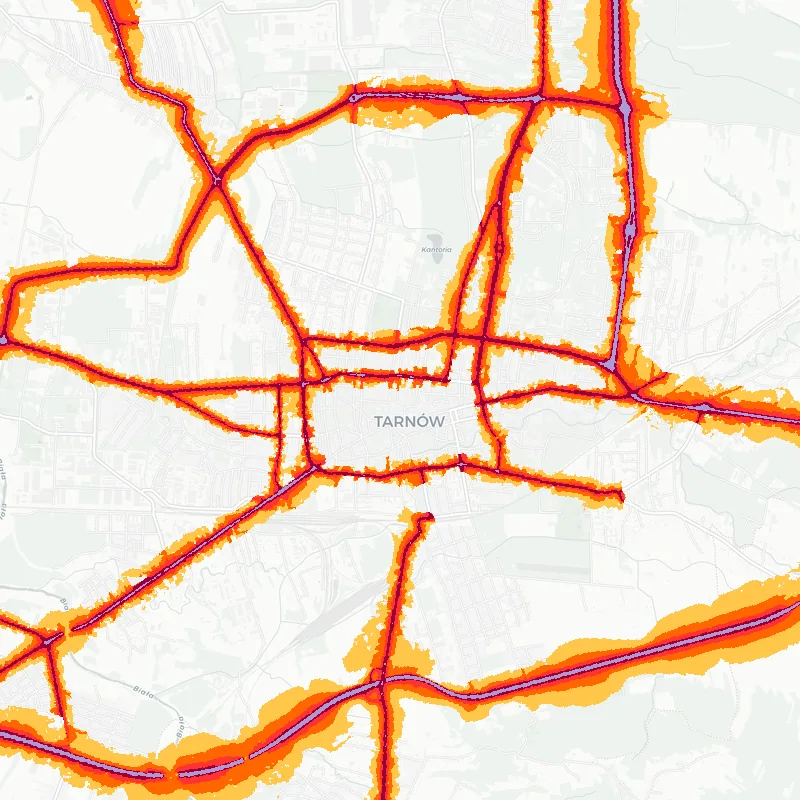 Noise map of Tarnow, Poland: road-traffic noise contours from the EU strategic noise maps, shaded yellow (≈55 dB Lden) through orange and red to dark purple (≈75 dB+), over the city's street network.