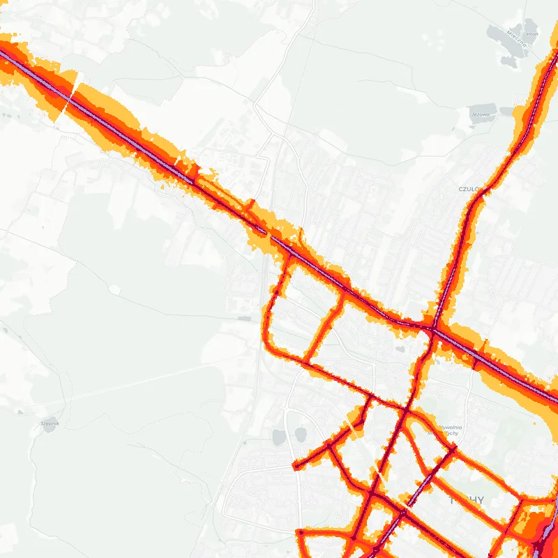 Noise map of Tychy, Poland: road-traffic noise contours from the EU strategic noise maps, shaded yellow (≈55 dB Lden) through orange and red to dark purple (≈75 dB+), over the city's street network.