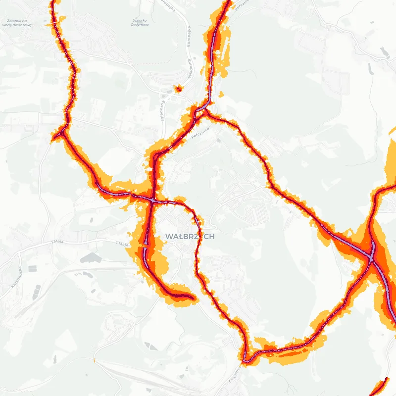 Noise map of Walbrzych, Poland: road-traffic noise contours from the EU strategic noise maps, shaded yellow (≈55 dB Lden) through orange and red to dark purple (≈75 dB+), over the city's street network.